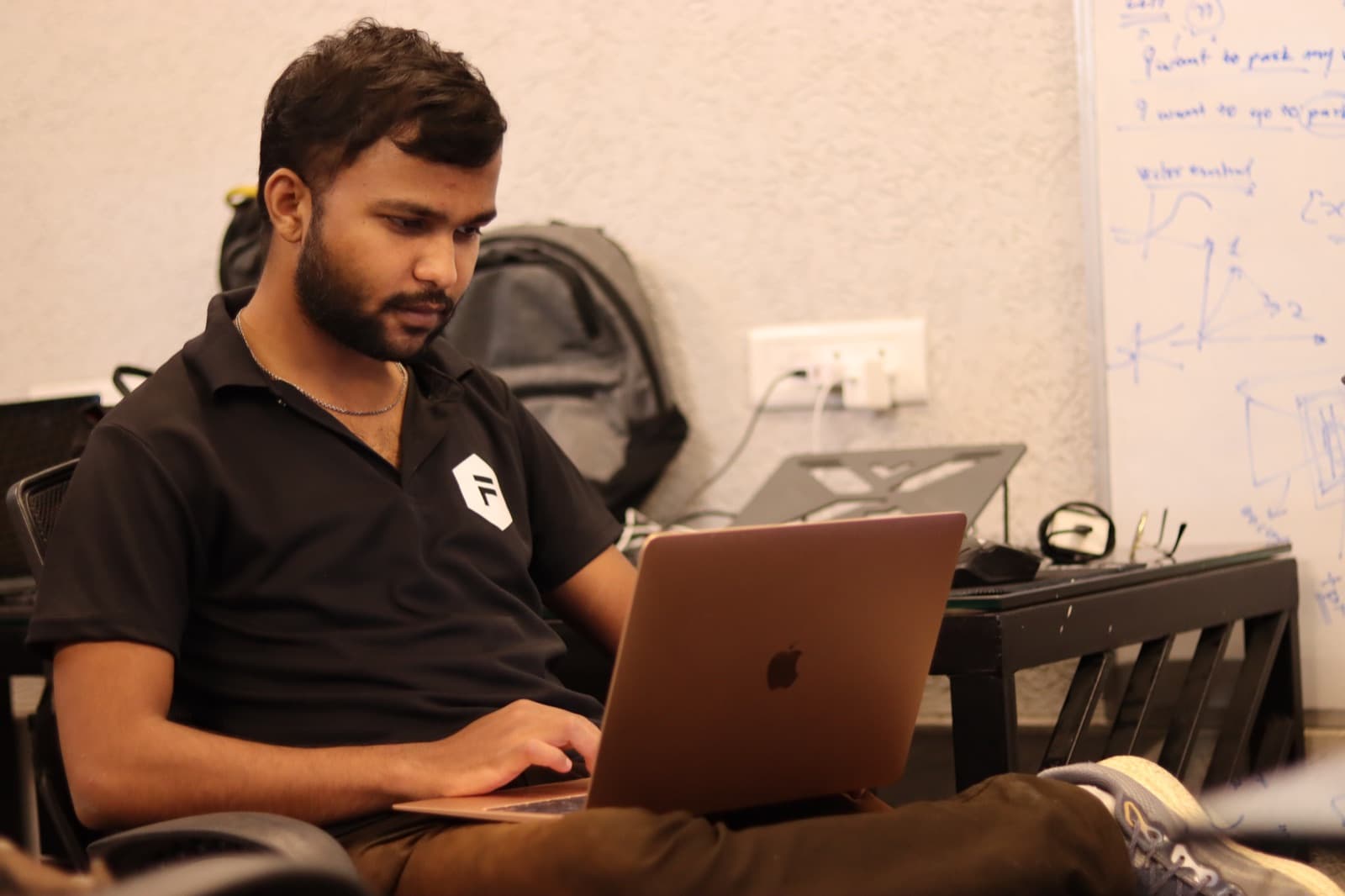 Ayush Rai, Founder of The Dream Protocol, working at a desk